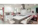 Spacious kitchen with white cabinets and an island at 5700 E Fort King St, Ocala, FL 34470