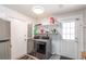 Laundry room with washer, dryer, and shelving at 5700 E Fort King St, Ocala, FL 34470