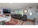 Living room boasts a fireplace, large TV, and comfortable leather sectional sofa at 5700 E Fort King St, Ocala, FL 34470