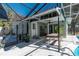 Covered patio with table and chairs adjacent to the pool at 5700 E Fort King St, Ocala, FL 34470