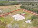 Aerial view of property showing home, barn and land at 1045 Carter Rd, Deland, FL 32724