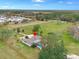 Aerial view of a ranch-style home with pool and expansive land at 1045 Carter Rd, Deland, FL 32724