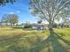 Landscaped backyard with pool and patio area at 1045 Carter Rd, Deland, FL 32724