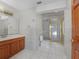 Bathroom with wood vanity and walk-in shower at 1045 Carter Rd, Deland, FL 32724