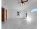 Bright and airy bedroom with tile floors and vaulted ceiling at 1045 Carter Rd, Deland, FL 32724