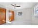 Bright bedroom with wood closet doors and tile floors at 1045 Carter Rd, Deland, FL 32724