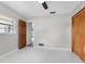 Spacious bedroom with wood door and tile floors at 1045 Carter Rd, Deland, FL 32724