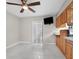 Bright kitchen with wood cabinets and granite countertops at 1045 Carter Rd, Deland, FL 32724