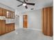 Kitchen with light wood cabinets, granite counters and stainless steel appliances at 1045 Carter Rd, Deland, FL 32724