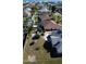 Aerial view of house, backyard, and pool; located in a residential neighborhood at 105 Barrier Isle Dr, Ormond Beach, FL 32176