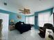 Primary bedroom with king bed and ceiling fan at 105 Barrier Isle Dr, Ormond Beach, FL 32176