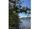 Wooden boardwalk over calm water, surrounded by trees at 105 Barrier Isle Dr, Ormond Beach, FL 32176