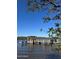 Wooden dock with gazebo on calm water at 105 Barrier Isle Dr, Ormond Beach, FL 32176