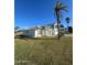 Single-story home with white exterior and spacious lawn at 105 Barrier Isle Dr, Ormond Beach, FL 32176