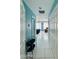 Bright hallway with light blue walls and tile floors at 105 Barrier Isle Dr, Ormond Beach, FL 32176