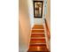 Clean staircase with wood flooring and simple design at 105 Barrier Isle Dr, Ormond Beach, FL 32176