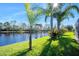 Landscaped backyard with lake access at 1221 Harwick Ln, Ormond Beach, FL 32174