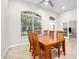 Bright dining room with wood table and six chairs at 1221 Harwick Ln, Ormond Beach, FL 32174