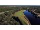 Aerial view of golf course and lakefront property at 1311 Hansberry Ln, Ormond Beach, FL 32174