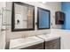 Double vanity bathroom with dark brown cabinets and mirrors at 1311 Hansberry Ln, Ormond Beach, FL 32174