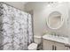 Bathroom with marble vanity and shower/tub combo at 1311 Hansberry Ln, Ormond Beach, FL 32174