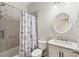 Bathroom with marble vanity and shower/tub combo at 1311 Hansberry Ln, Ormond Beach, FL 32174