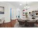 Bright dining room features a round table with seating for six and a chandelier at 1311 Hansberry Ln, Ormond Beach, FL 32174