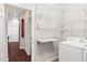 Laundry room featuring washer, dryer, and built-in shelving at 1311 Hansberry Ln, Ormond Beach, FL 32174