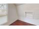 Serene attic bedroom corner with wood floors and built-in shelves at 141 Kingston Ave, Daytona Beach, FL 32114