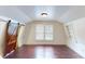 Spacious attic bedroom with wood floors and built-in shelves at 141 Kingston Ave, Daytona Beach, FL 32114