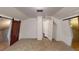 Bright attic bedroom featuring stylish barn doors and carpet at 141 Kingston Ave, Daytona Beach, FL 32114