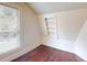 Cozy attic bedroom corner with wood floors and built-in shelves at 141 Kingston Ave, Daytona Beach, FL 32114