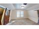 Spacious bedroom with carpeted floors and barn door at 141 Kingston Ave, Daytona Beach, FL 32114