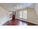 Light-filled bedroom with hardwood floors and barn door at 141 Kingston Ave, Daytona Beach, FL 32114