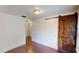 Cozy bedroom with hardwood floors and barn door at 141 Kingston Ave, Daytona Beach, FL 32114