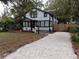 Charming renovated home with a gravel driveway and fenced yard at 141 Kingston Ave, Daytona Beach, FL 32114