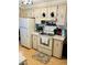 Well-equipped kitchen featuring white cabinets and a stove at 215 Rue De Paresse, Tavares, FL 32778