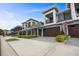 Townhomes with attached garages, balconies, and a neatly landscaped street at 2840 Isles Way, New Smyrna Beach, FL 32168