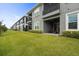 Modern townhouses with private patios and lush green lawns at 2840 Isles Way, New Smyrna Beach, FL 32168