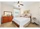 Cozy bedroom with double bed, dresser and side table at 3189 Connemara Dr, Ormond Beach, FL 32174