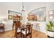 Elegant dining room with hardwood floors and view of kitchen at 3189 Connemara Dr, Ormond Beach, FL 32174