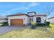 Beautiful one-story home with a two-car garage and landscaped yard at 3189 Connemara Dr, Ormond Beach, FL 32174