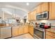 Kitchen with stainless steel appliances and granite countertops at 3189 Connemara Dr, Ormond Beach, FL 32174