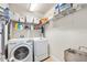 Laundry room with washer, dryer, and ample storage at 3189 Connemara Dr, Ormond Beach, FL 32174