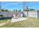 Small backyard with a concrete patio and wooden fence at 35 Country Club Dr, Ormond Beach, FL 32176