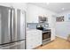 Updated kitchen featuring stainless steel appliances and white cabinetry at 35 Country Club Dr, Ormond Beach, FL 32176