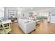 Light and airy living room with light gray couch and built-in shelving at 35 Country Club Dr, Ormond Beach, FL 32176