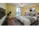 Virtually staged bedroom with a queen-size bed and TV at 4565 S Atlantic Ave # 5601, Port Orange, FL 32127