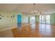 Spacious living room featuring hardwood floors and large windows at 4565 S Atlantic Ave # 5601, Port Orange, FL 32127