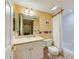 Bathroom with a shower/tub combo, toilet, and vanity at 4670 Links Village Dr # B201, Ponce Inlet, FL 32127